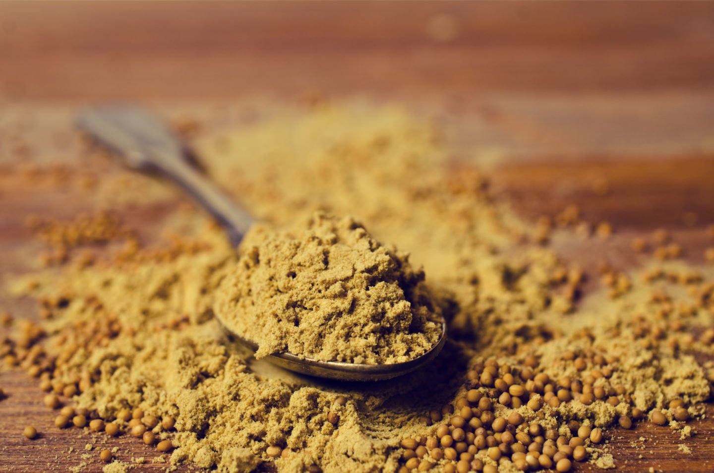 Ground Mustard Powder In Spoon