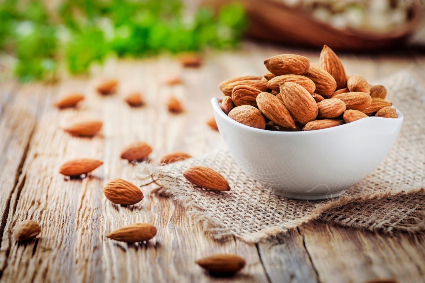 handful of almonds in white bowl