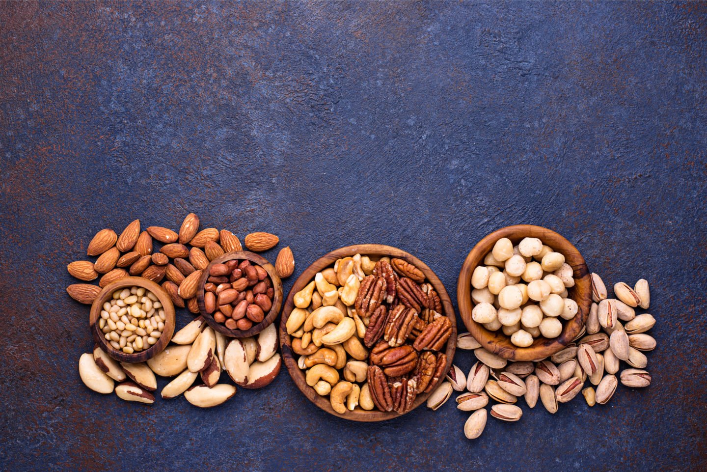 Handfuls Of Various Nuts On Table