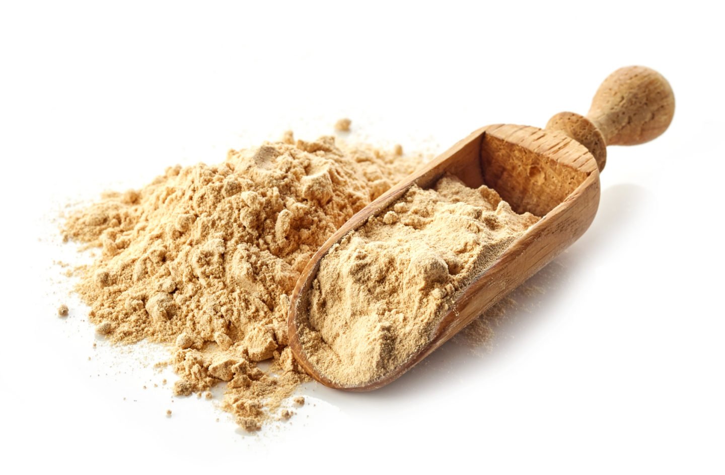 maca powder in wooden scoop