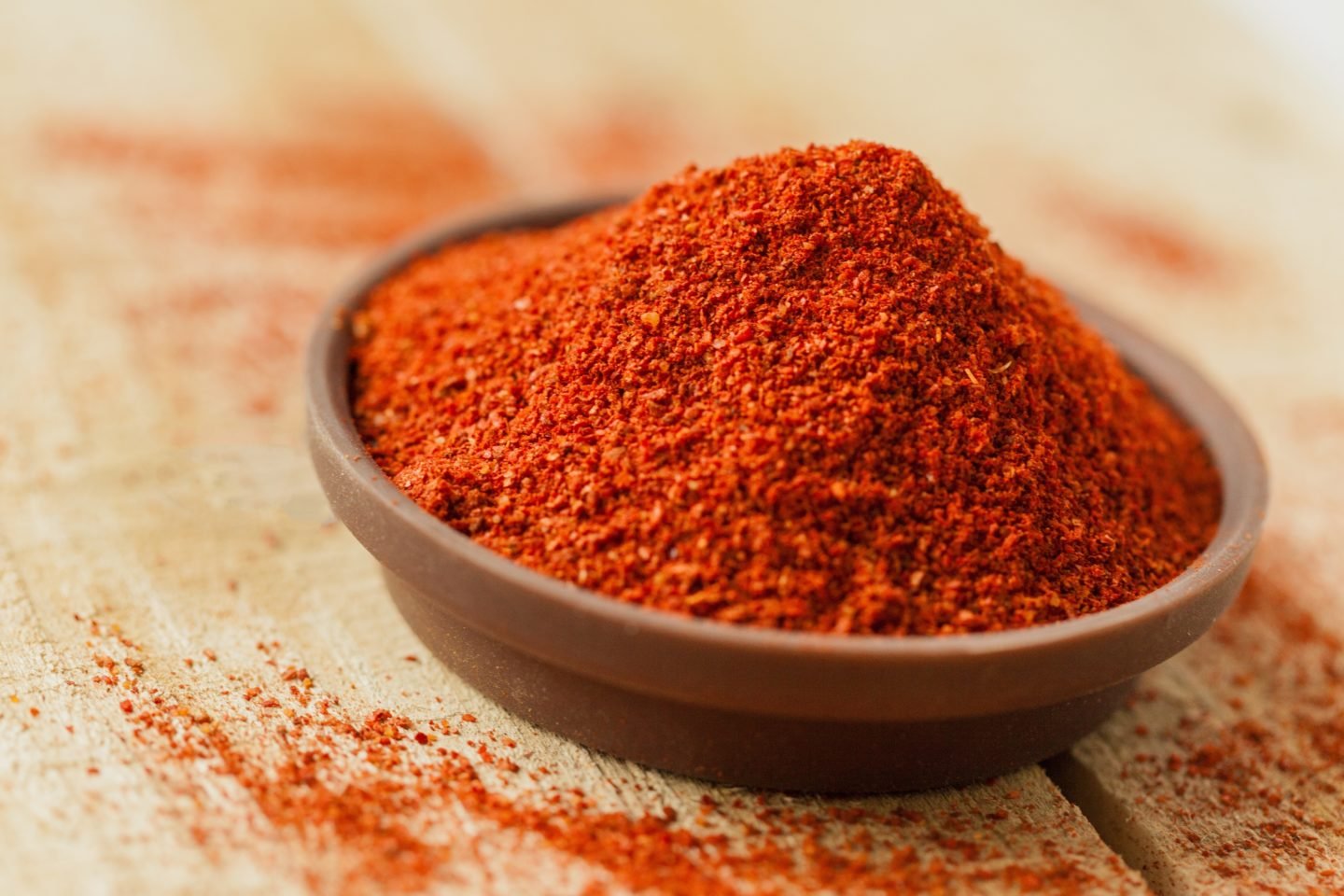 Paprika Powder In Shallow Wooden Bowl