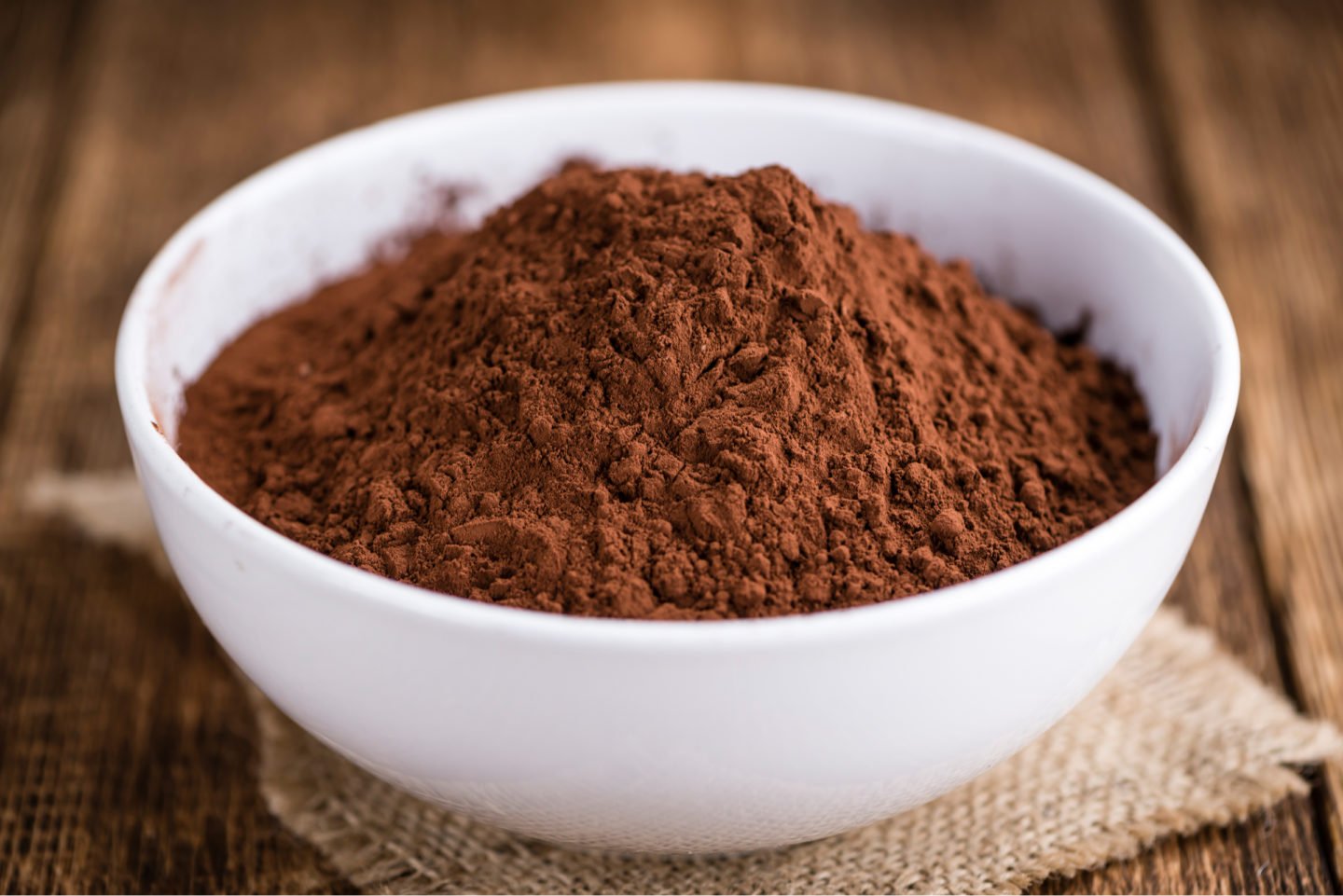 Raw Cacao Powder In White Bowl