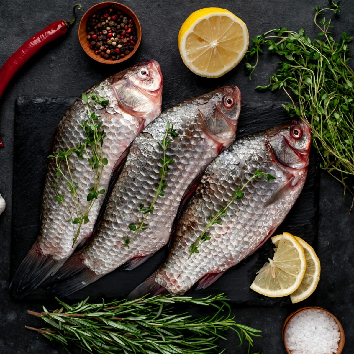 raw carp with lemon herbs and spices