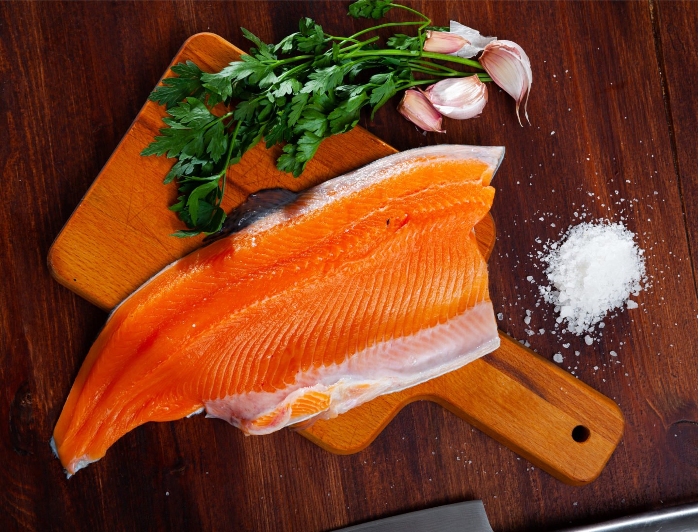 Raw Trout Fillet On Cutting Board