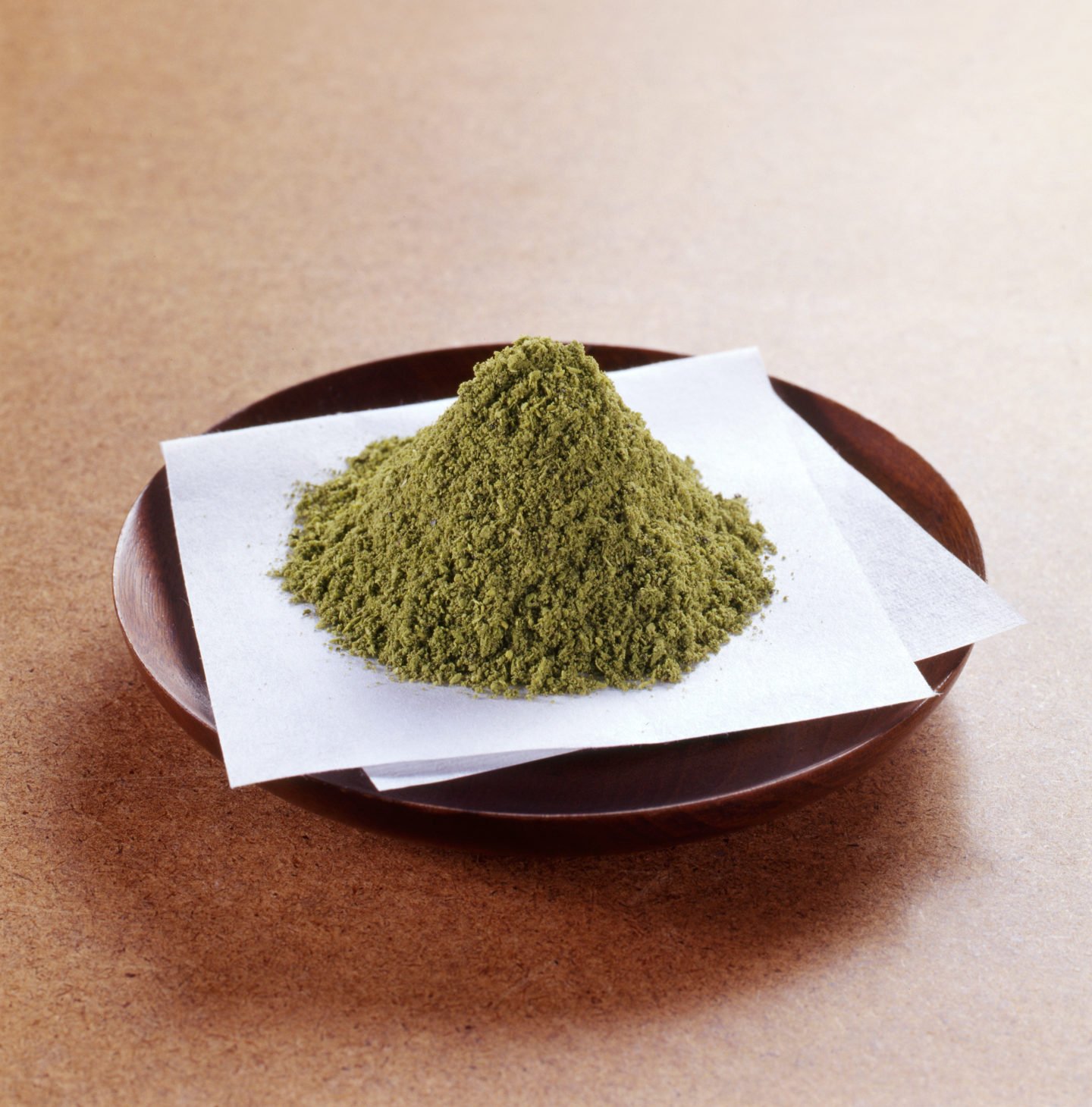 Sansho Powder On Japanese Paper Over Wooden Bowl