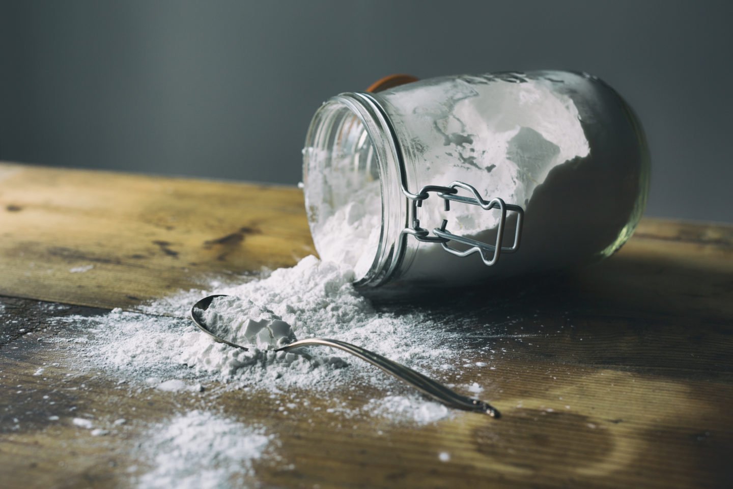 Spilled Arrowroot Powder From Glass Jar