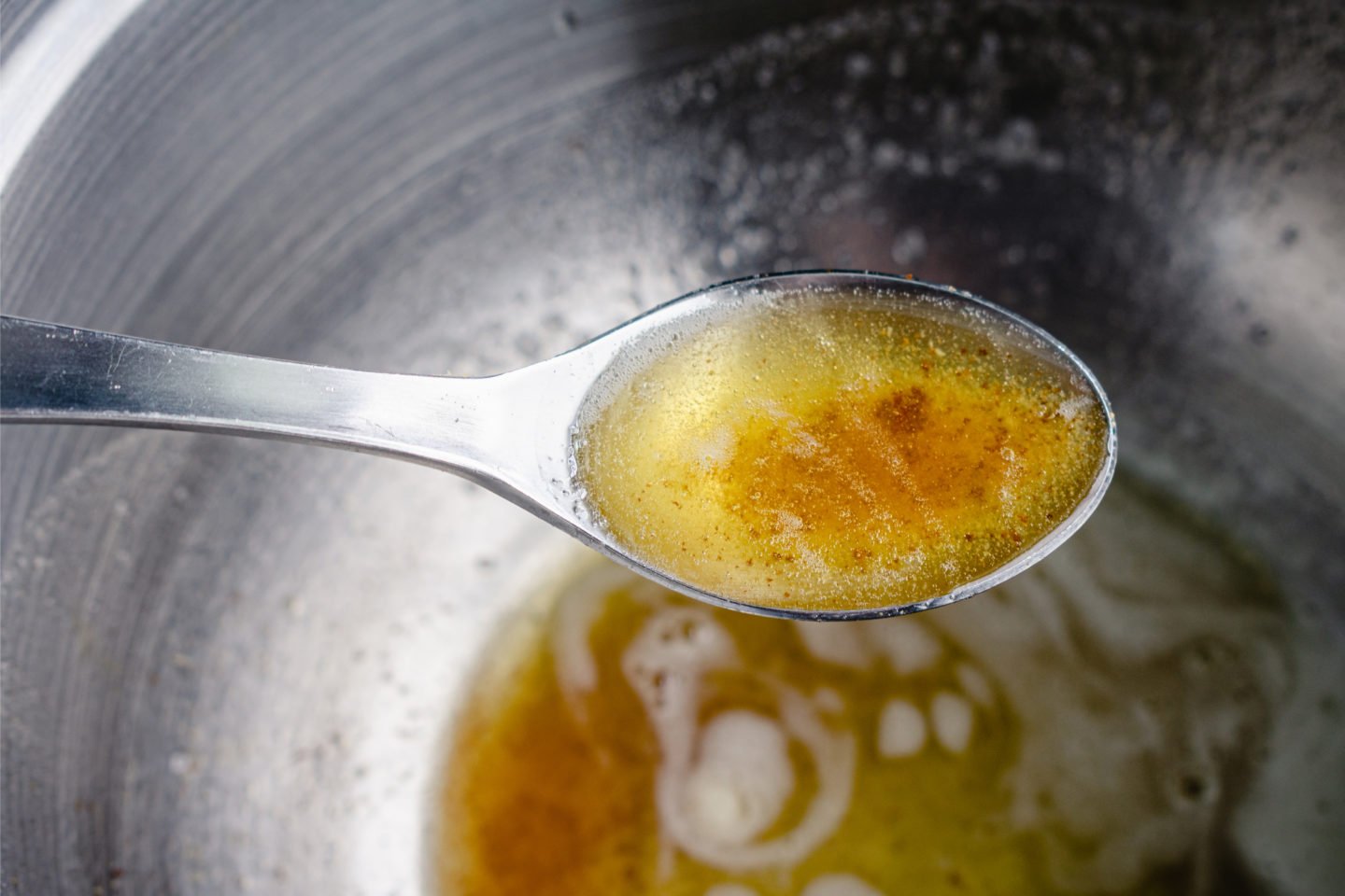 Tablespoon Of Browned Butter Over Mixing Bowl