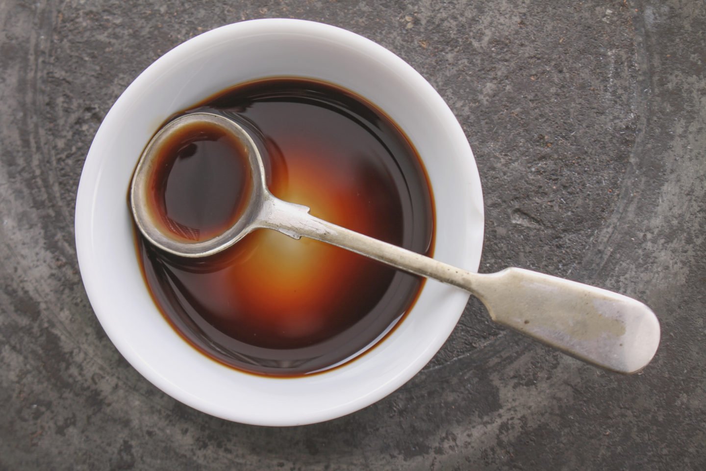 Worcestershire Sauce In Shallow White Bowl With Spoon