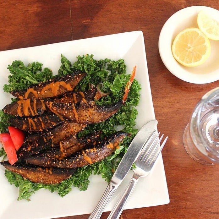 Lov'n It Live raw mushroom steak over kale