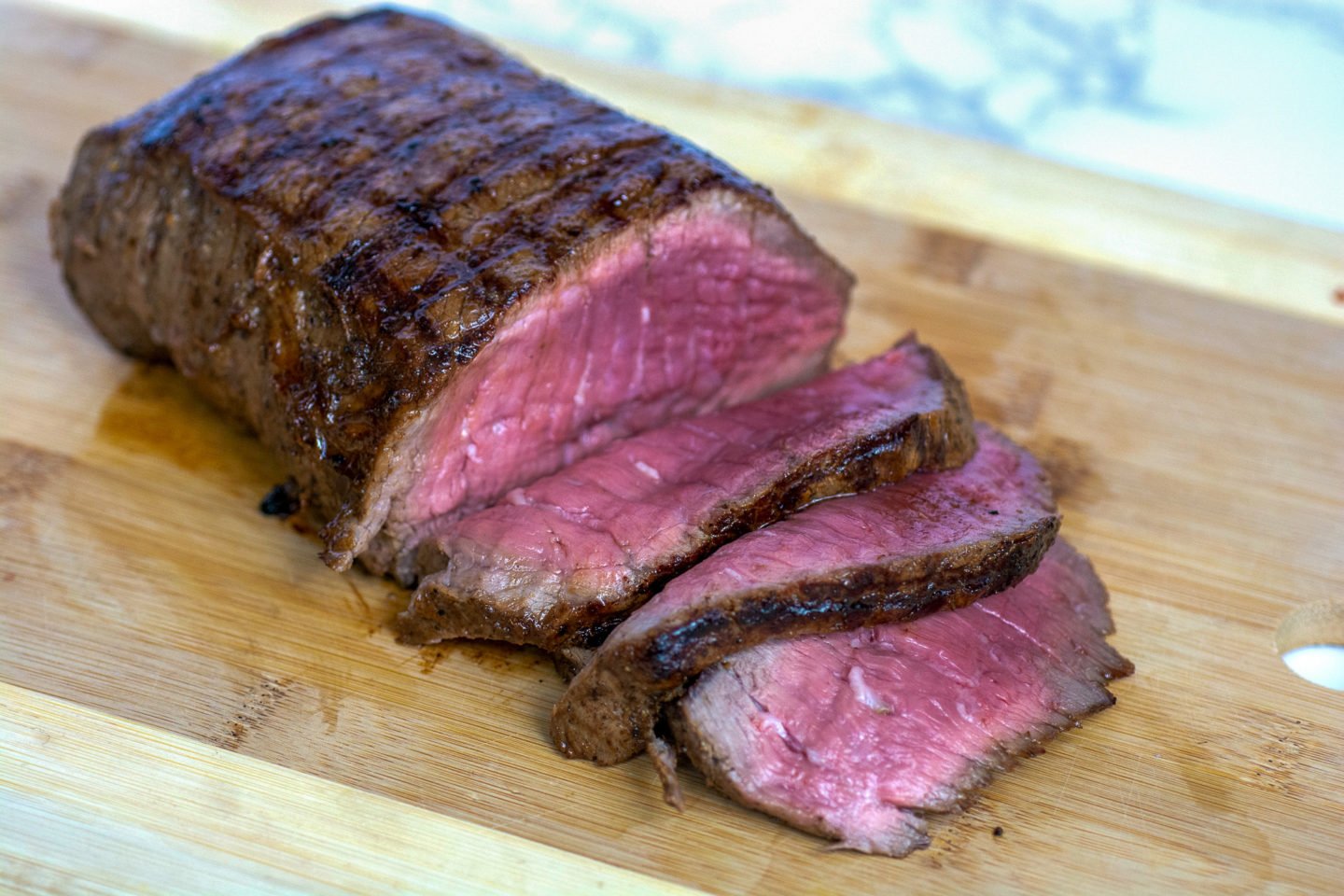 Grilled Keto London Broil Served On Wooden Board