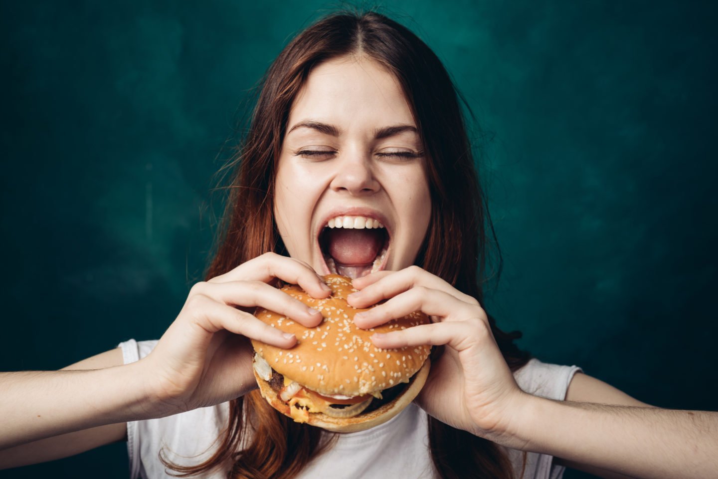 woman eating a hamburger