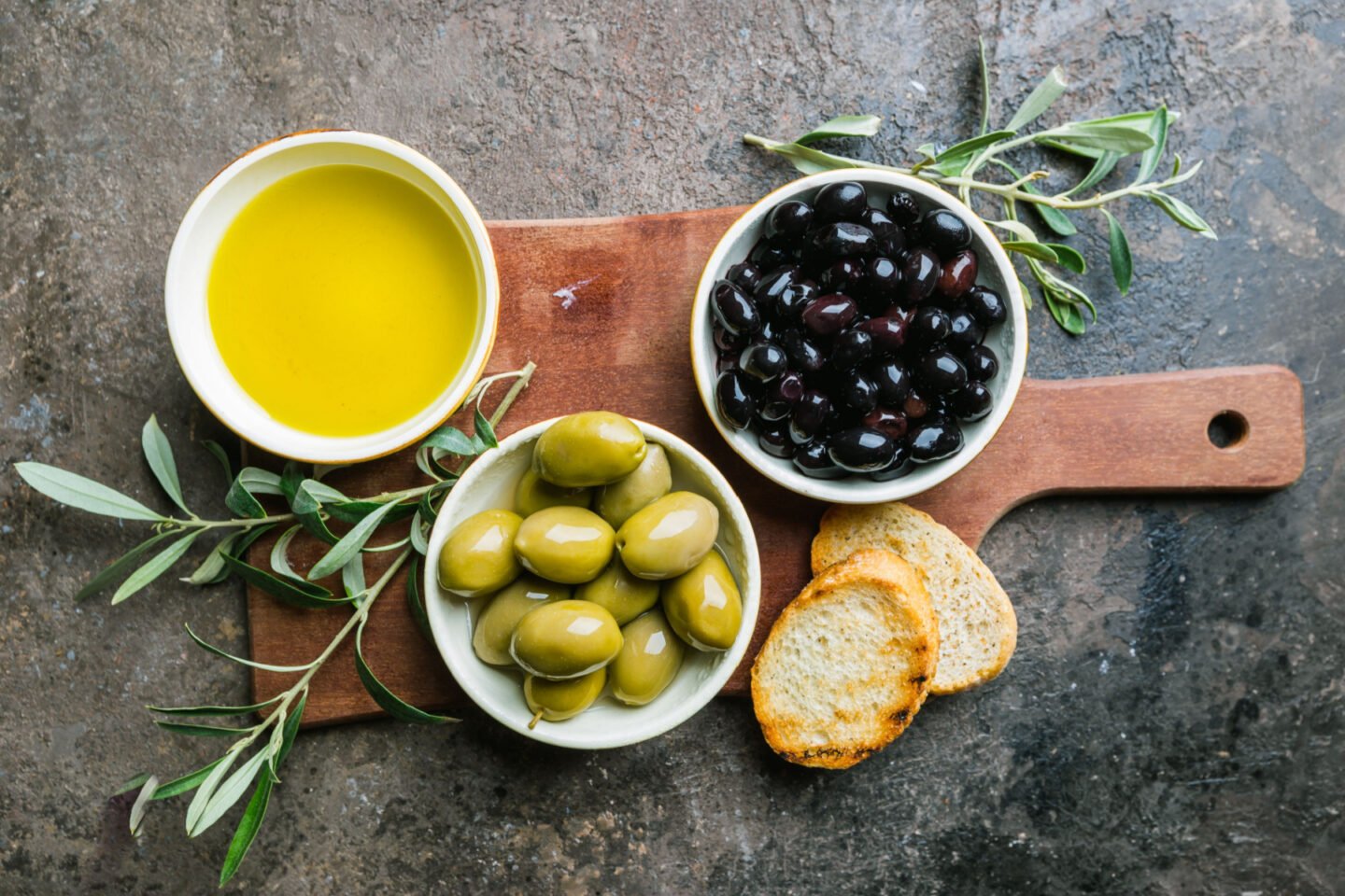 green and black olives with olive oil