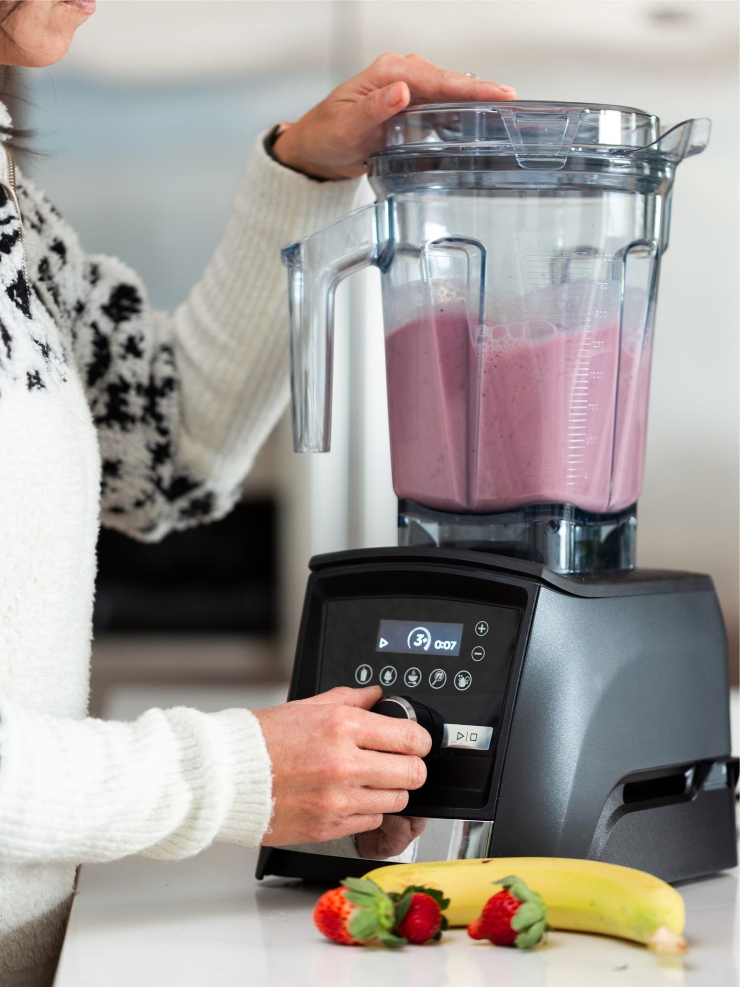 Woman Making Smoothie In Blender