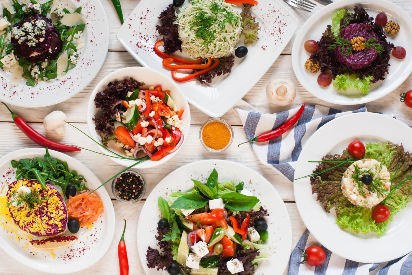 an assortment of fresh vegetable salads