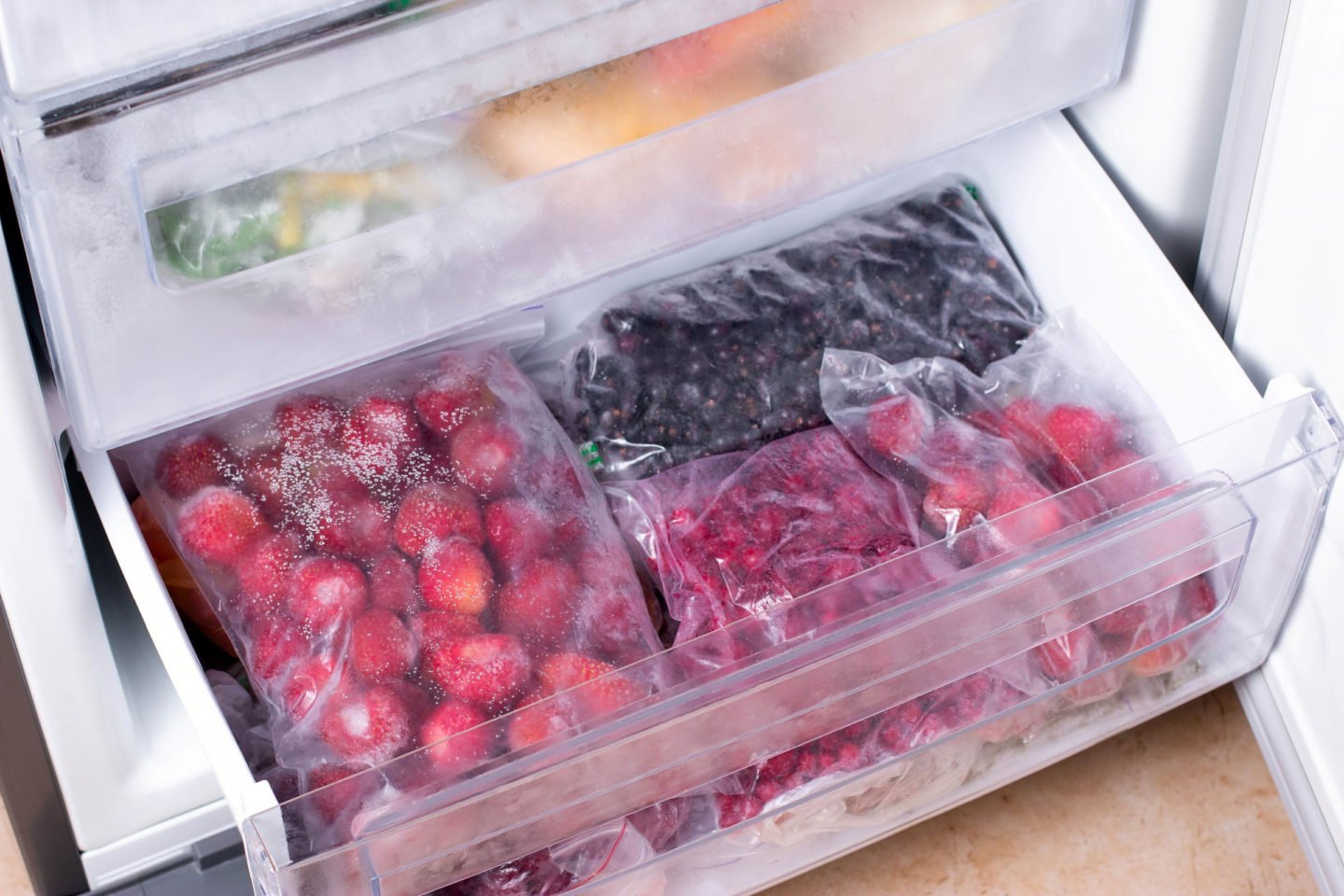 Bags Of Frozen Fruits In Freezer