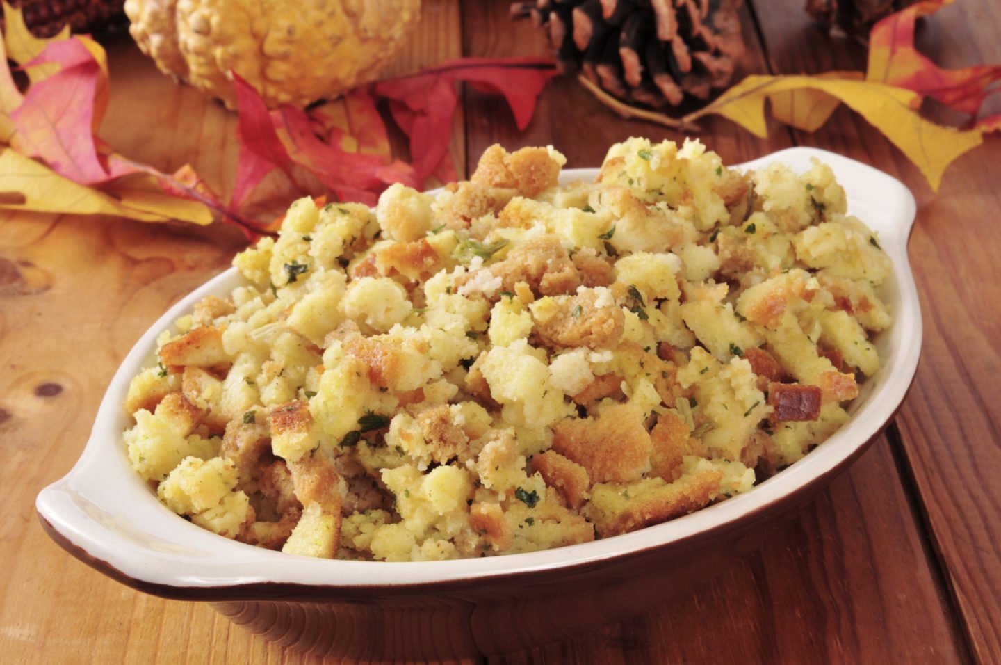 cornbread stuffing in a serving dish served on Thanksgiving