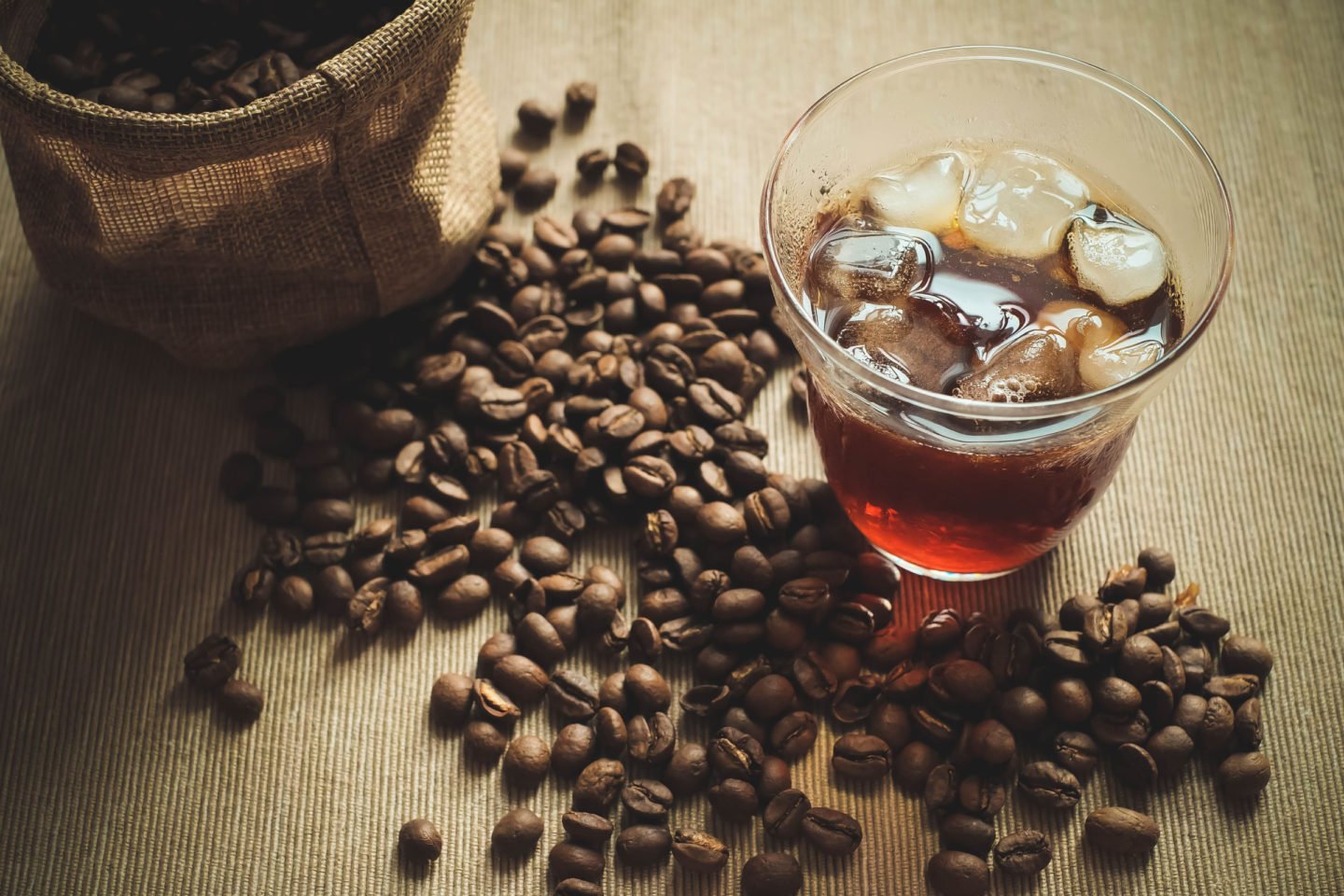 Glass Of Ice Cold Brew Coffee With Beans