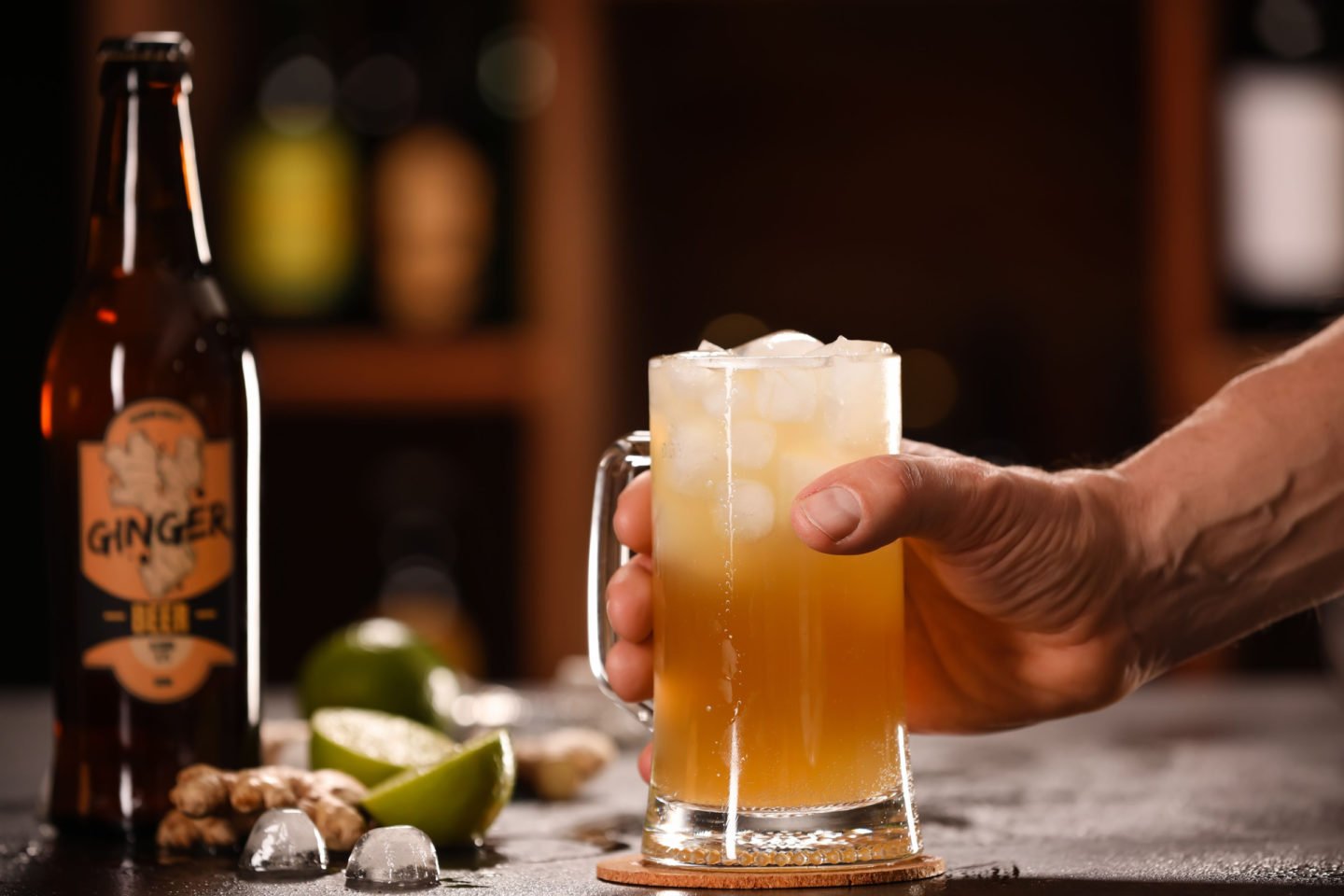 Man Holding Mug Of Ginger Beer