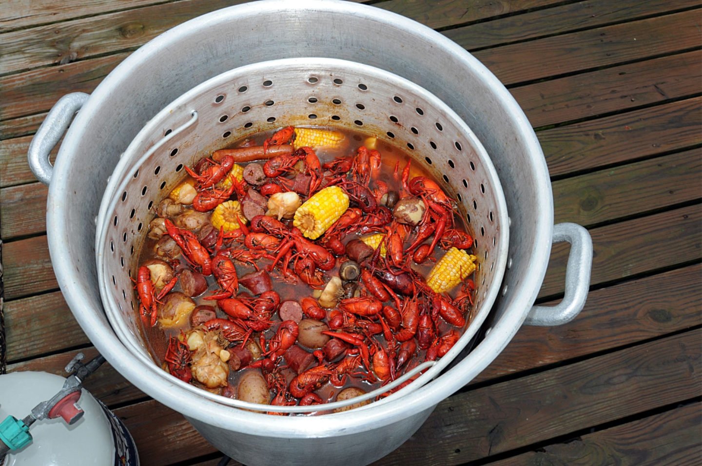 Pot And Steaming Basket Of Seafood Boil