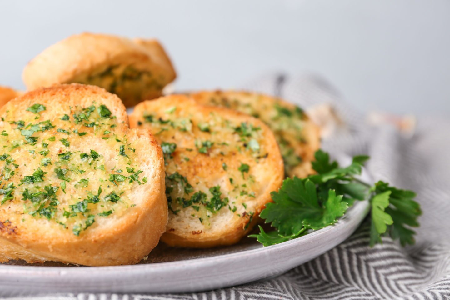 slices of toasted bread topped with garlic confit and herbs