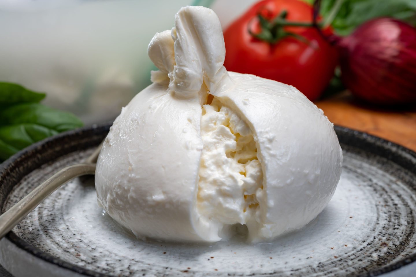 White Ball Of Burrata Made Of Mozzarella And Cream