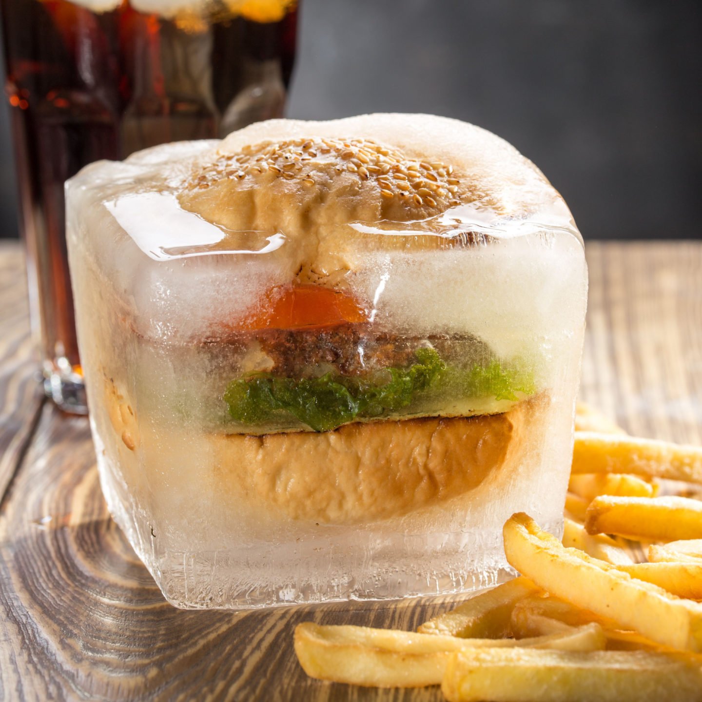 frozen hamburger in ice with fries and coke