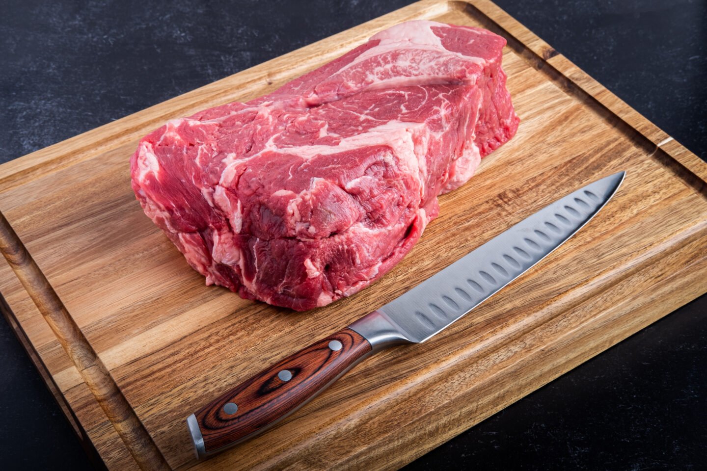 Boneless,Beef,Chuck,Roast,On,A,Cutting,Board,With,A