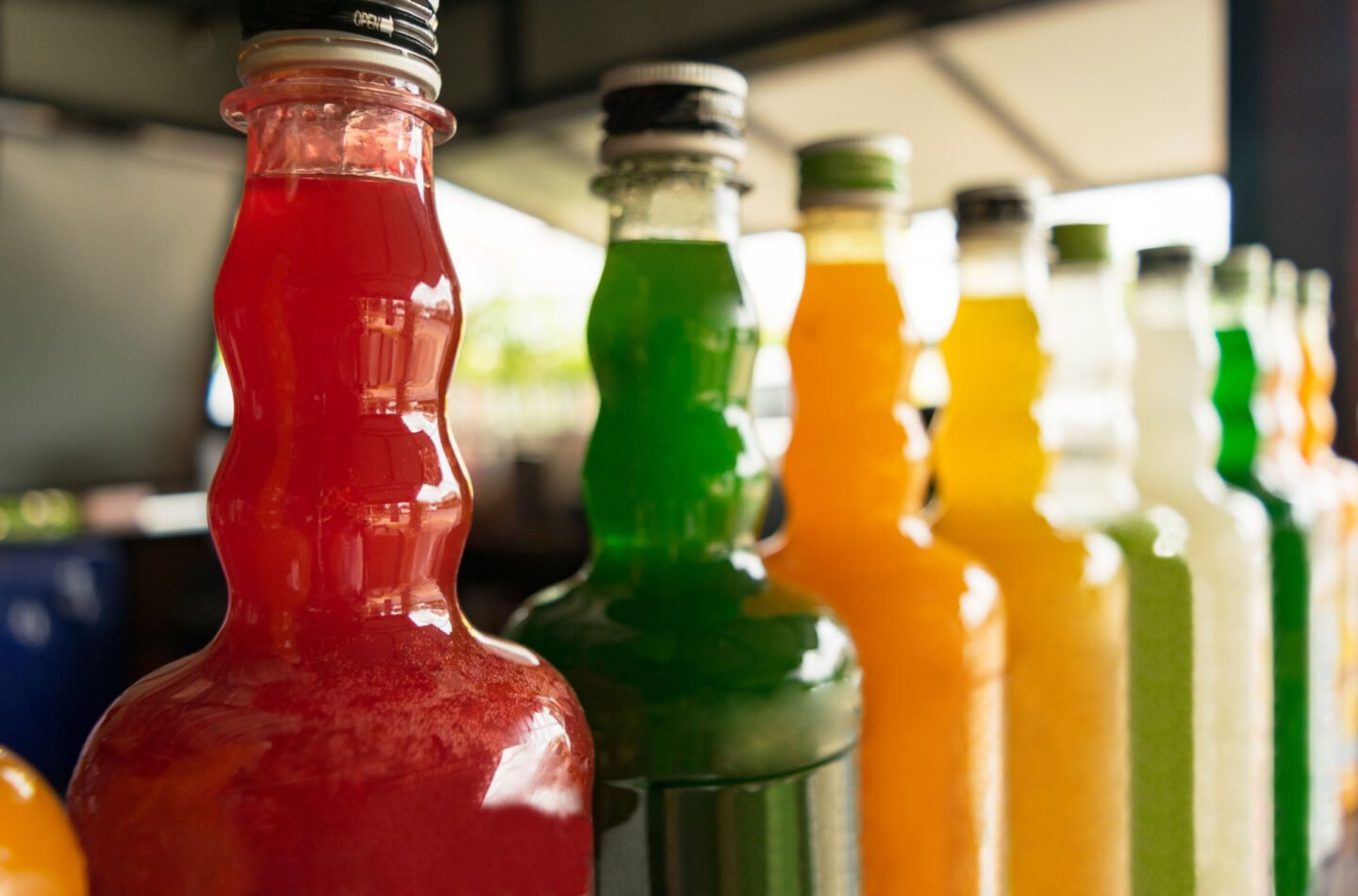 bottles of different fruit syrups