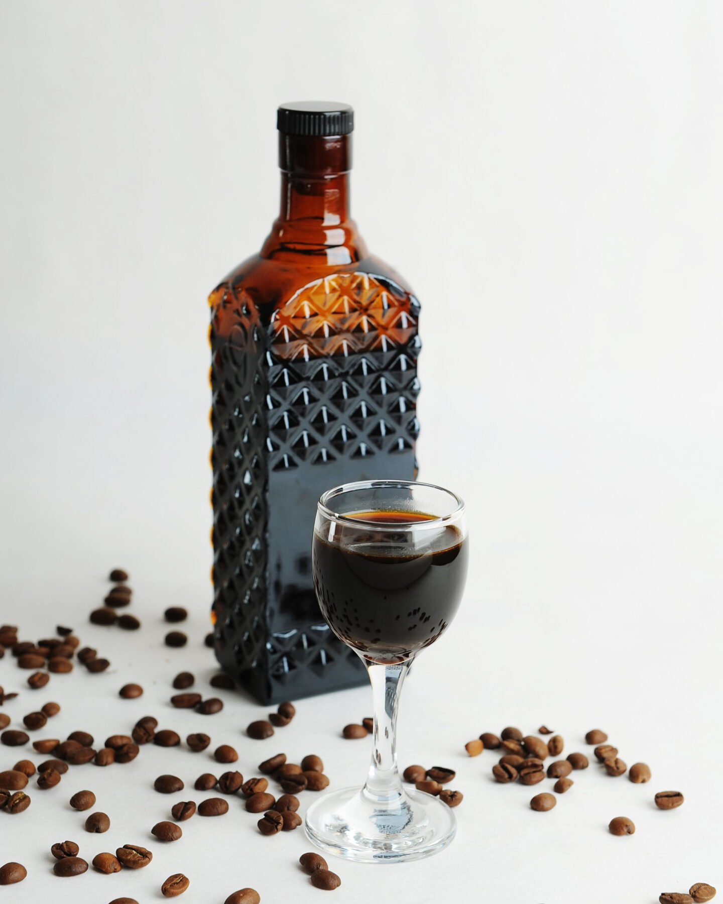 coffee liqueur in a glass and bottle