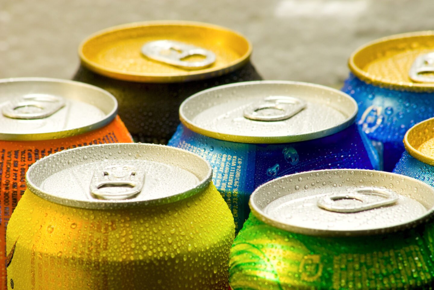 cold cans of soda sugary beverages