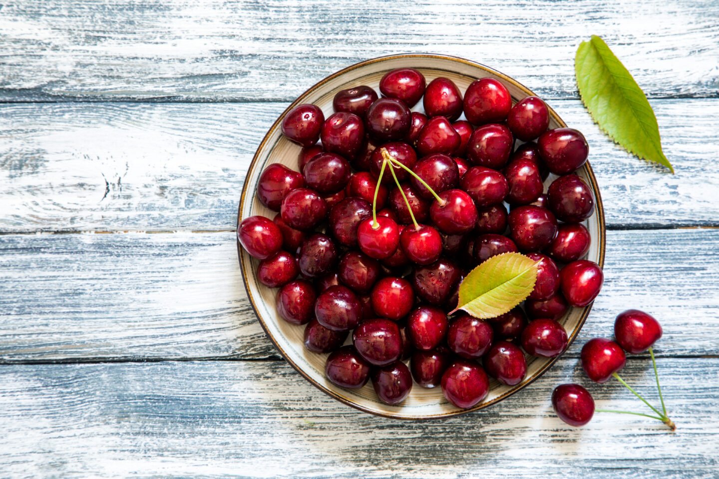 Fresh,Cherry,On,Plate,On,Wooden,Blue,Background.,Fresh,Ripe