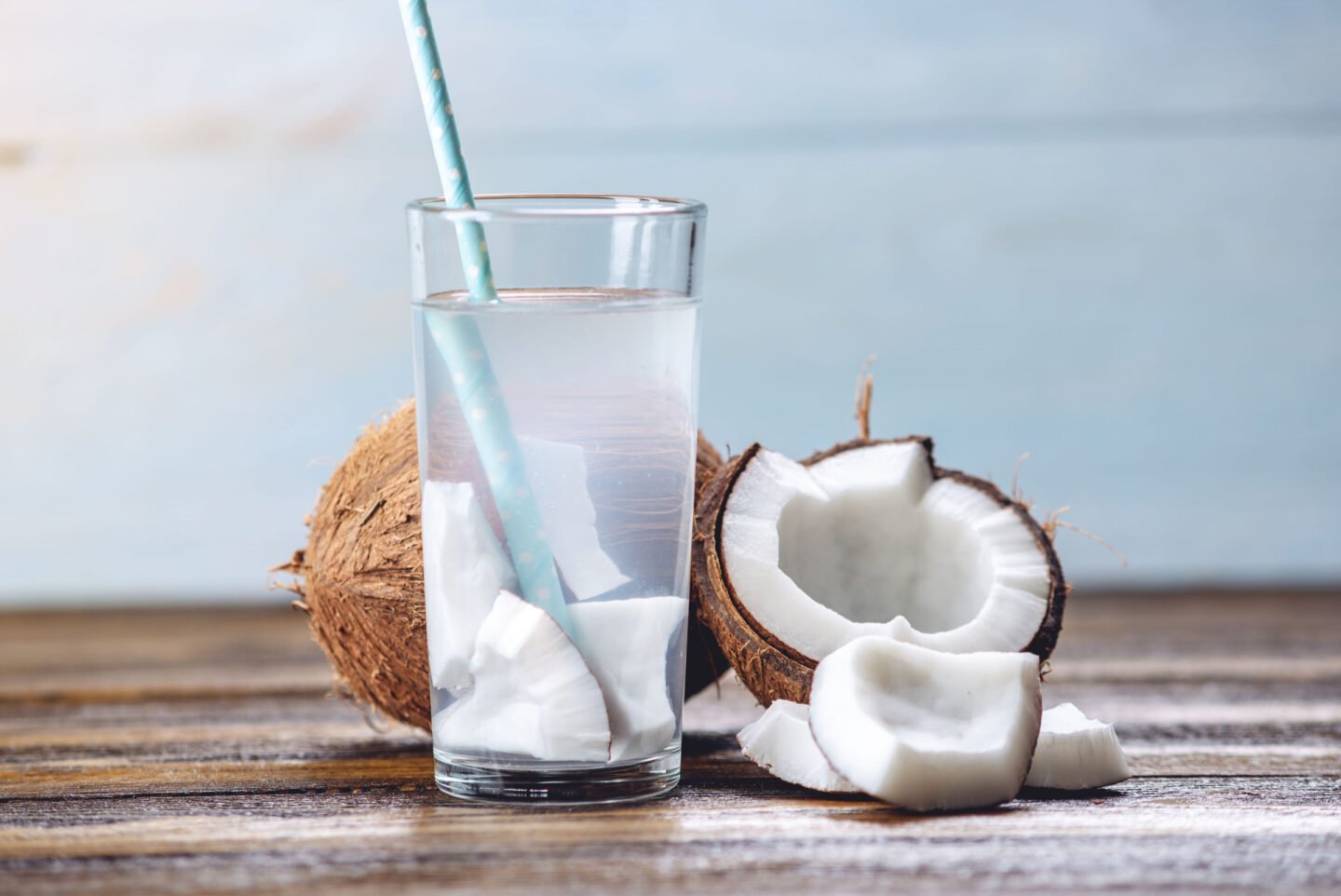 fresh coconut water in glass with coconut meat