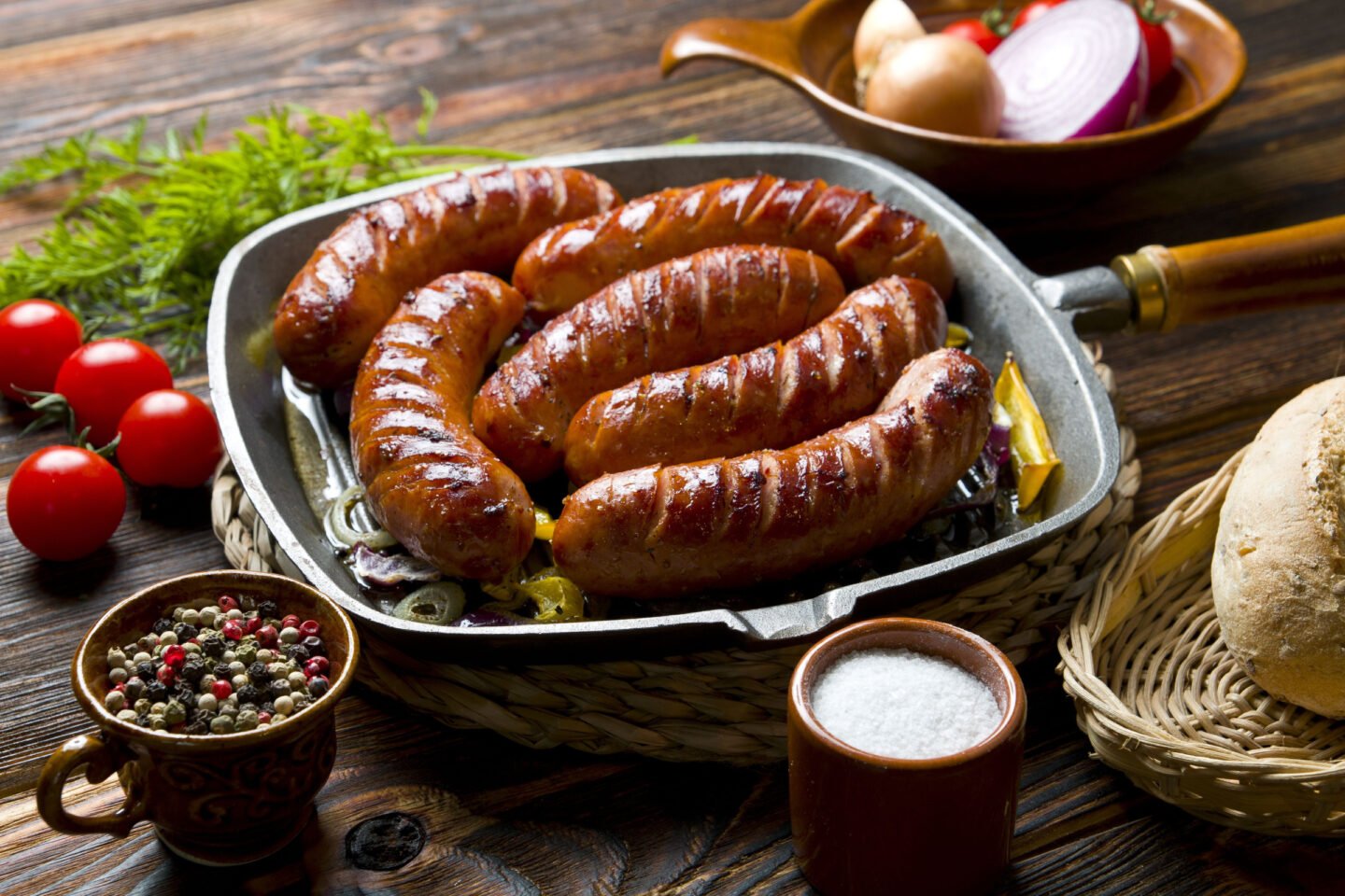 grilled sausages on a griddle