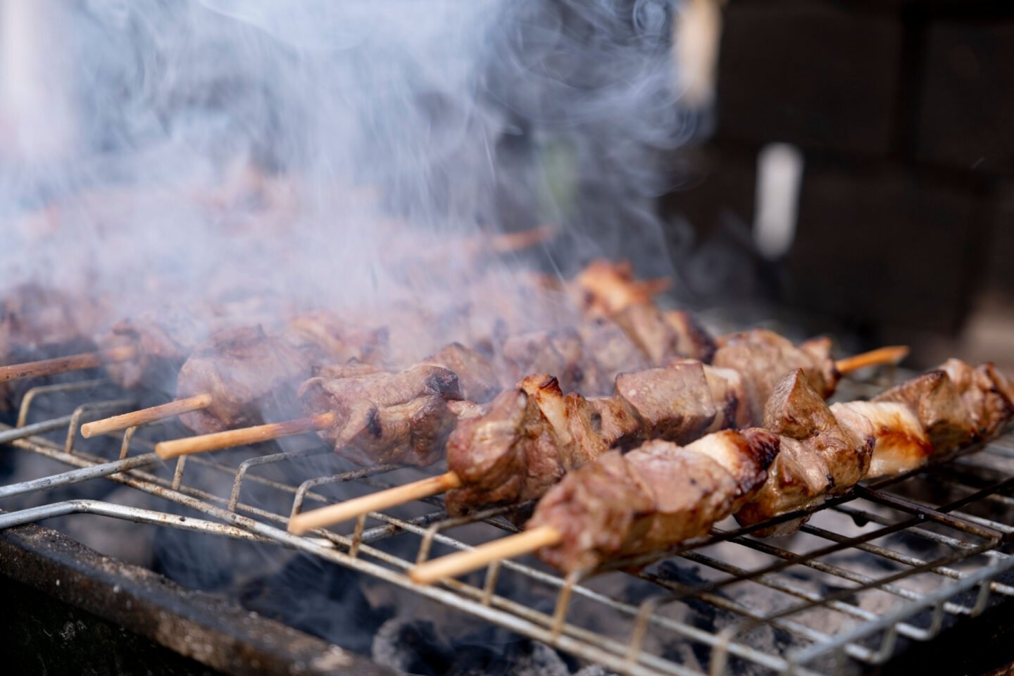 grilling shish kebab over charcoal