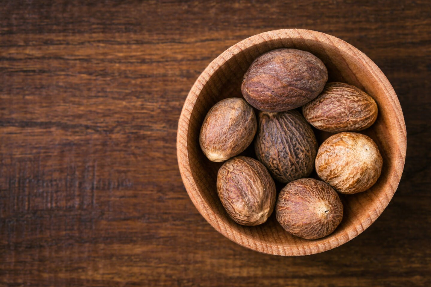 Nutmeg,,Close up,,Aromatic,Spice,,Wooden,Background