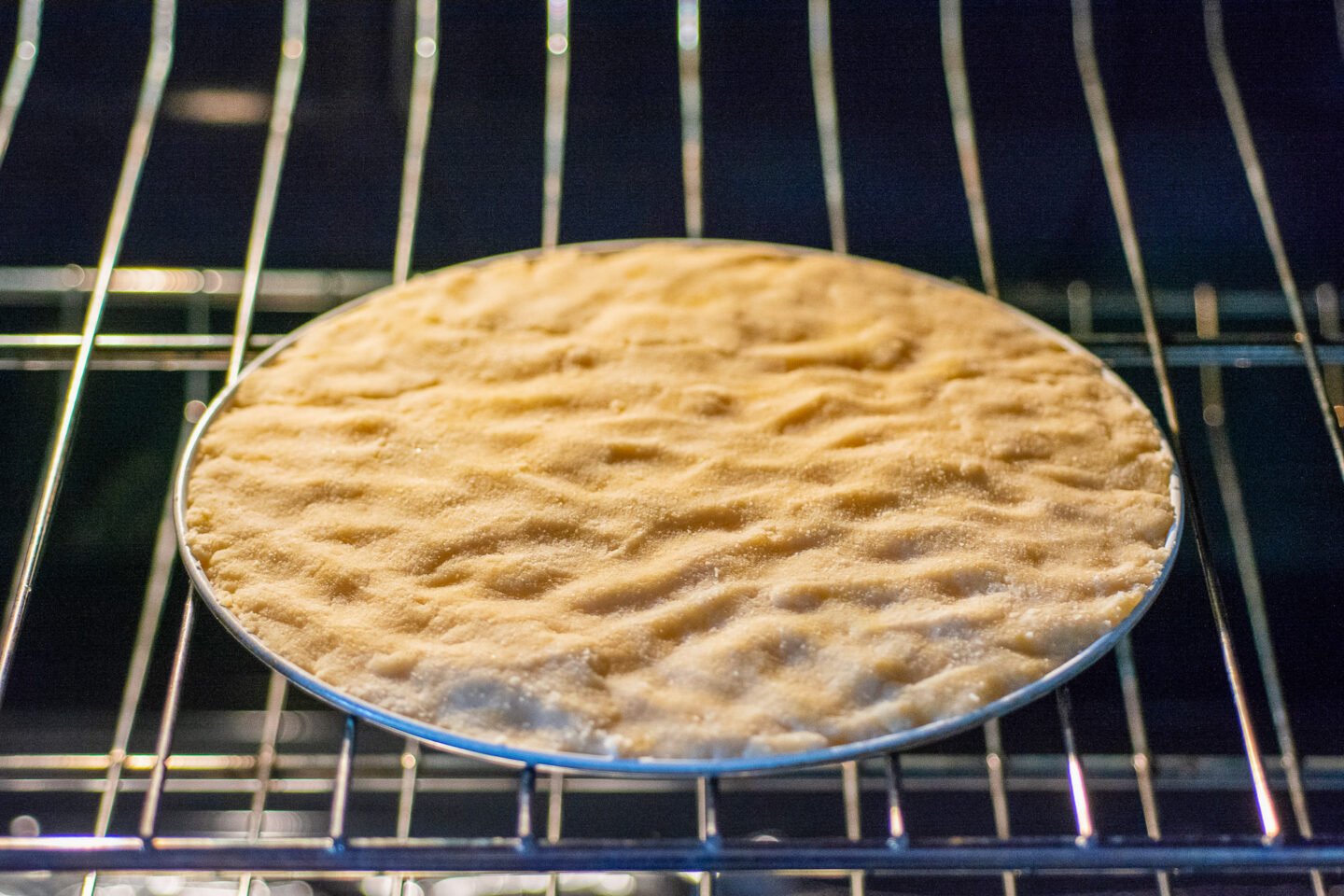 homemade keto pizza crust in the oven