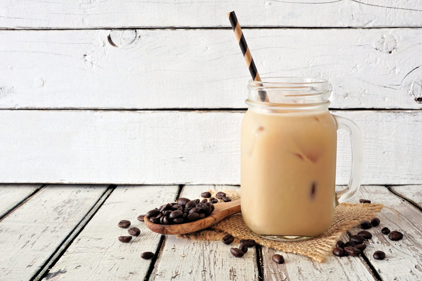 Cool,Summer,Iced,Latte,In,A,Mason,Jar.,Side,View