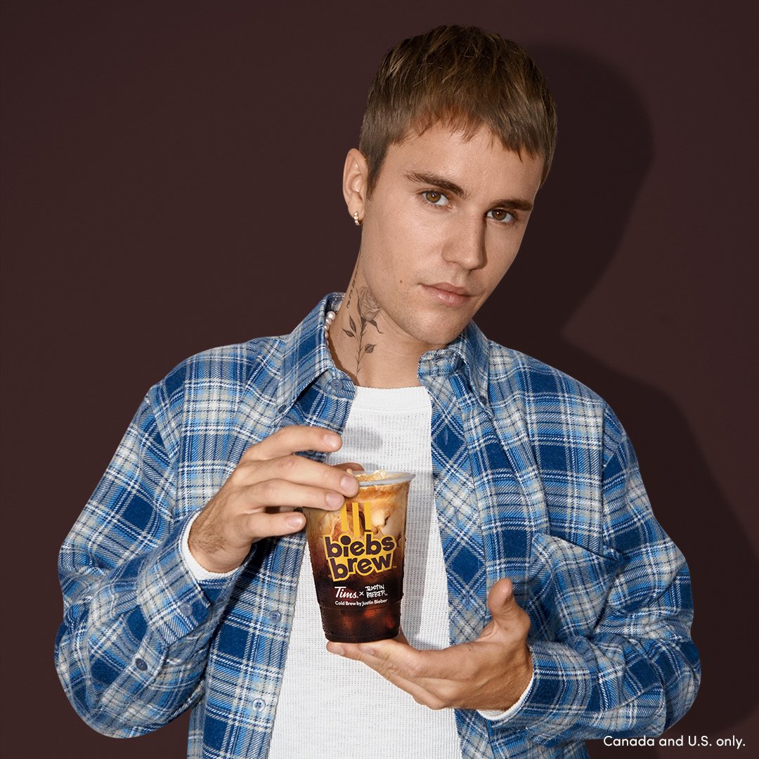 justin bieber holding cup of tim hortons biebs brew