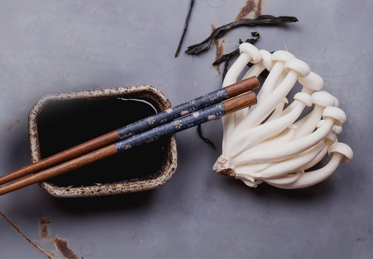 mushroom flavored dark soy sauce with chopsticks