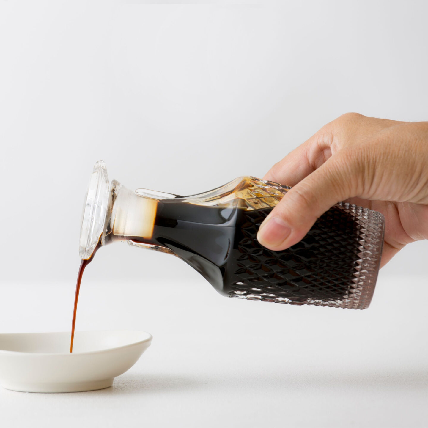 pouring worcestershire sauce into bowl