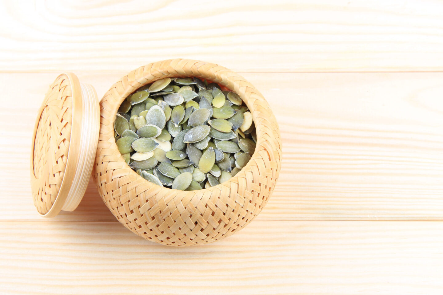 pumpkin seeds in a tiny basket