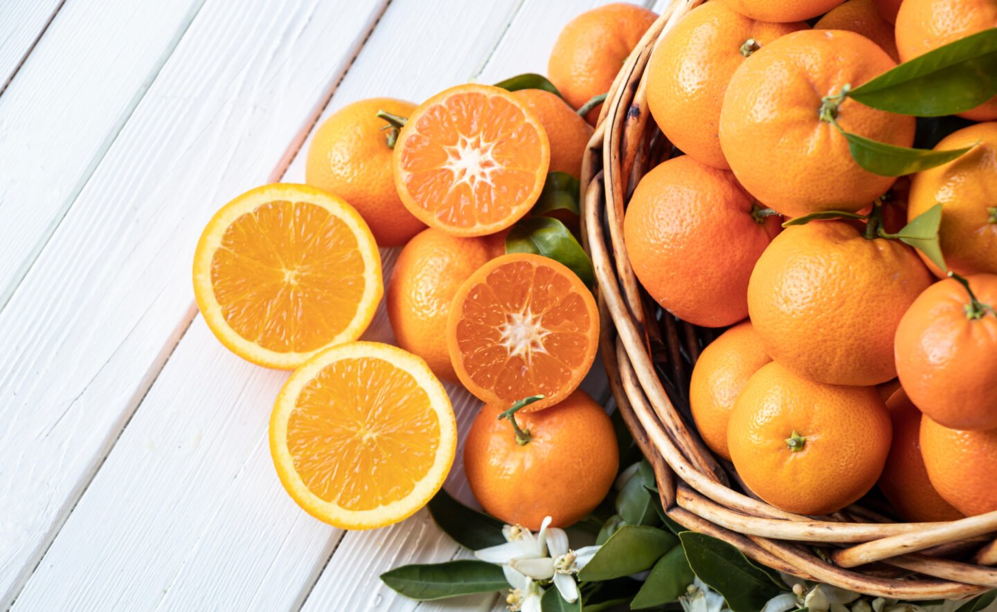 Orange,Fruit,With,Green,Leaves,On,The,White,Wood.,Home