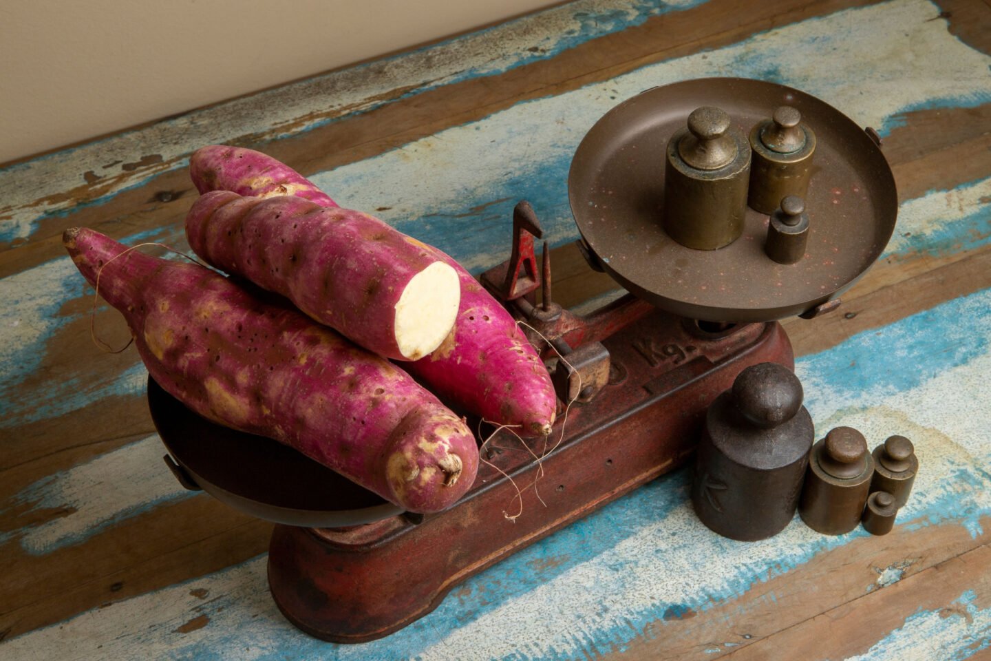 sweet potatoes on a vintage weighing scale