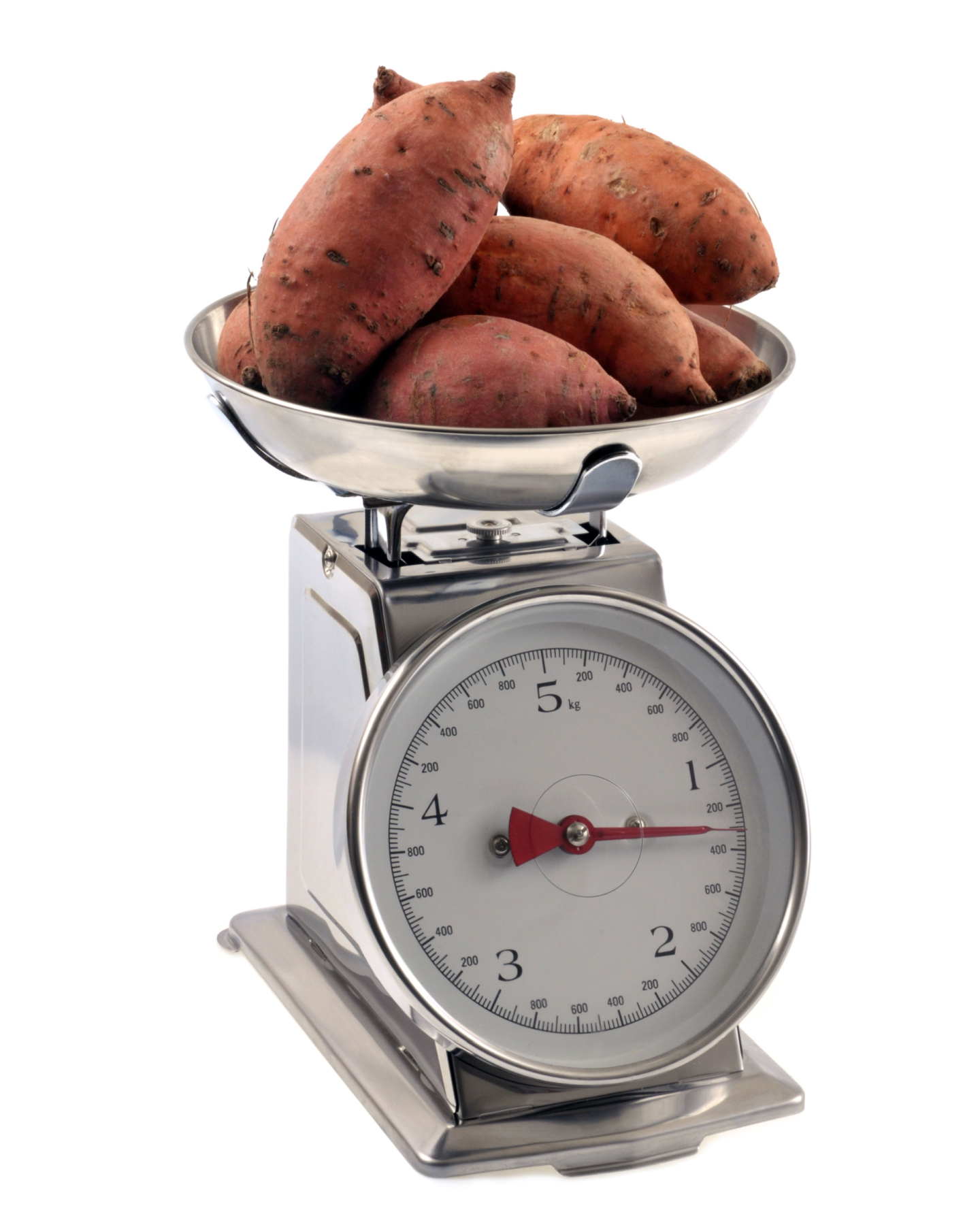 sweet potatoes on a weighing scale