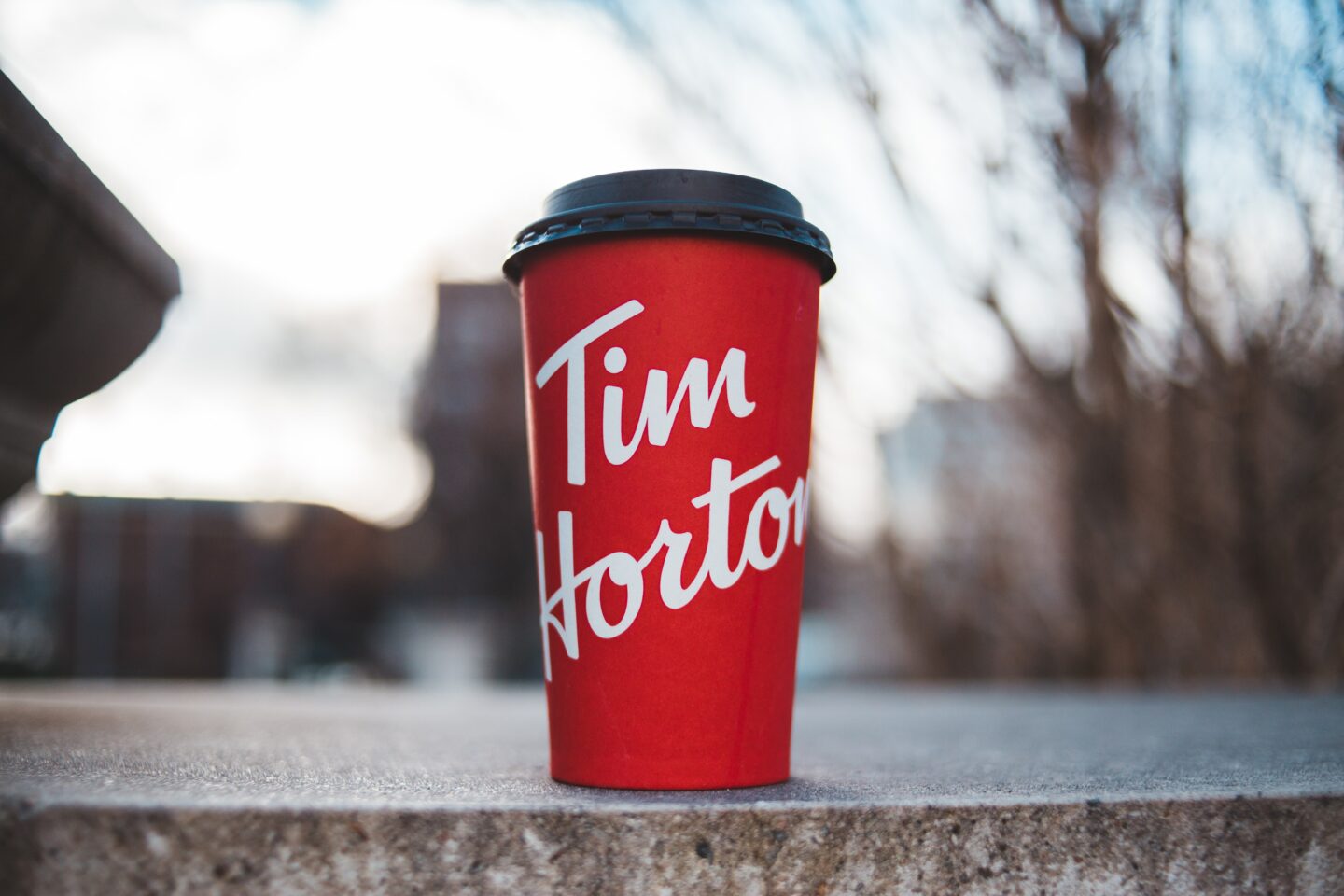 tim hortons takeaway cup on stone surface