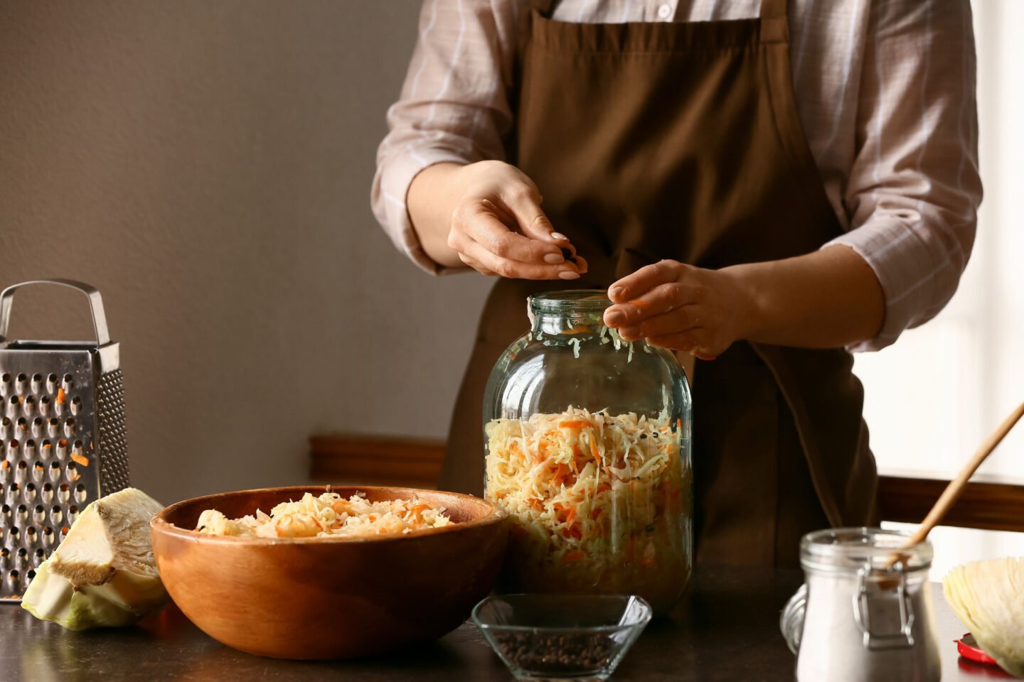 woman making homemade sauerkraut