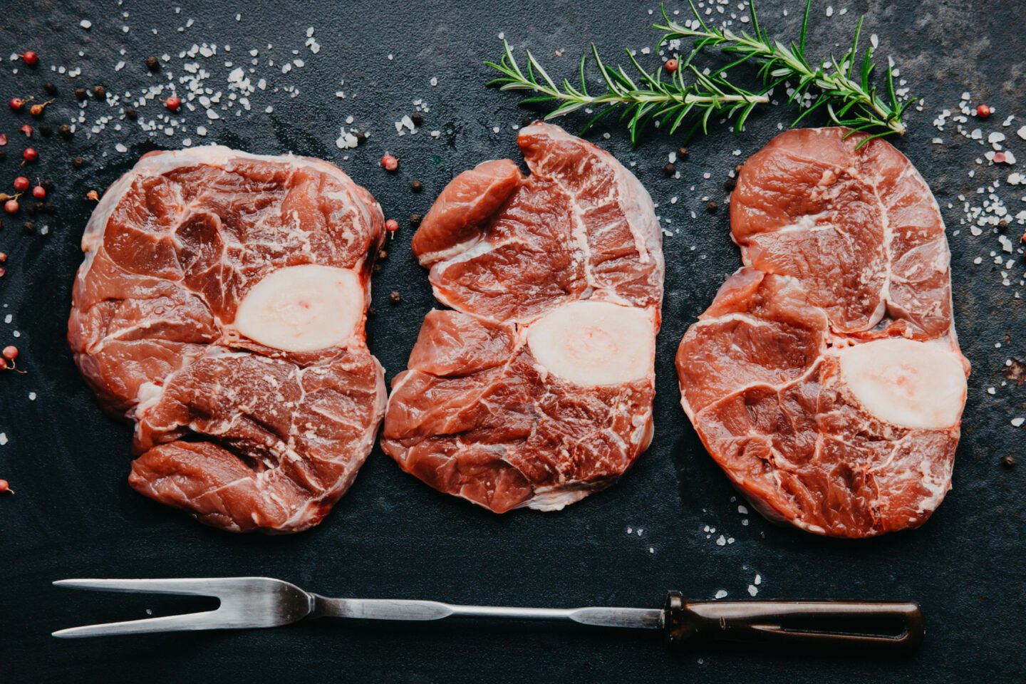 beef steaks with carving knife and fork