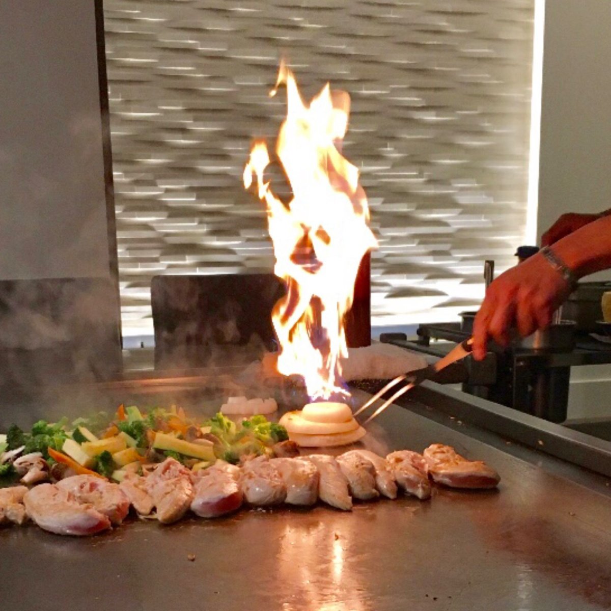 chef cooking on hibachi grill