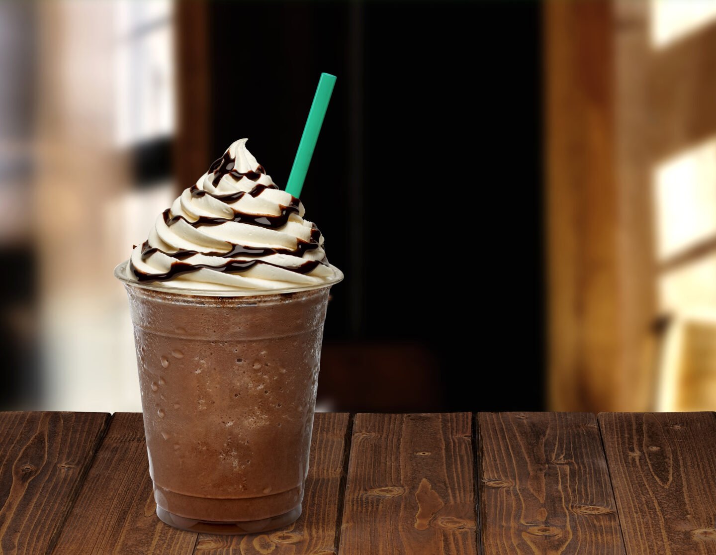 Frappuccino,In,Plastic,Takeaway,Or,To,Go,Cup,On,Wooden