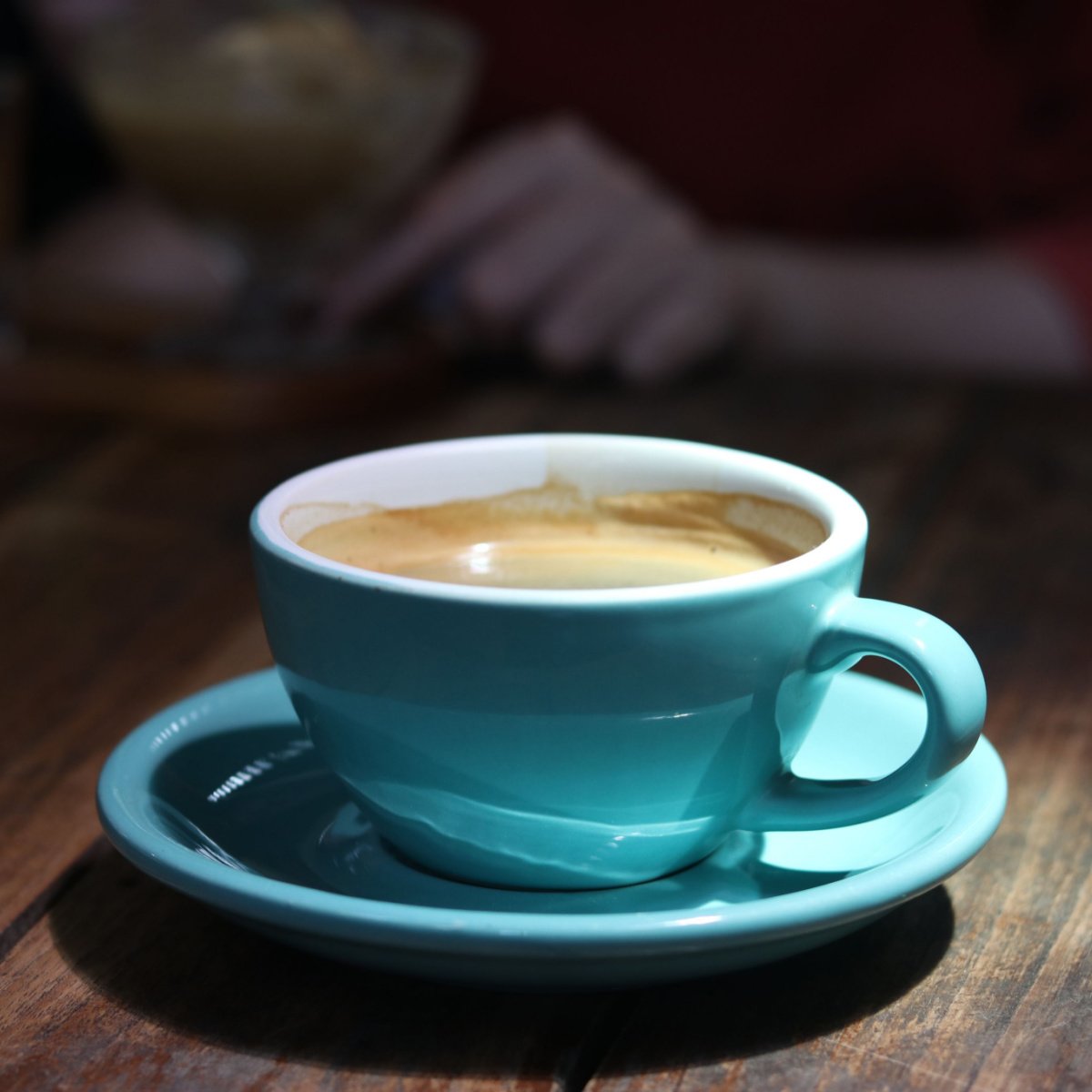 coffee in blue cup and saucer